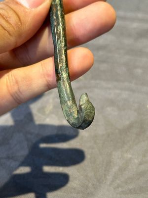 A varied collection of six Chinese bronze belt hooks, Warring States period and Western Han — photo 22
