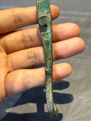 A varied collection of six Chinese bronze belt hooks, Warring States period and Western Han — photo 24