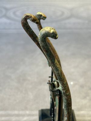 A varied collection of six Chinese bronze belt hooks, Warring States period and Western Han — photo 31