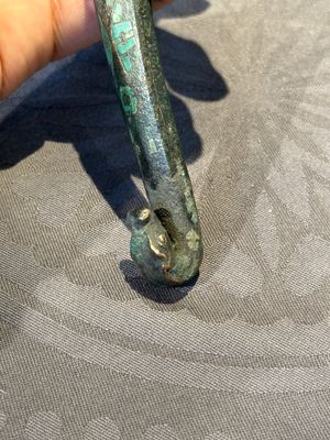 A varied collection of six Chinese bronze belt hooks, Warring States period and Western Han — photo 9