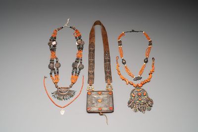 A varied group of four Islamic necklaces and a Quran holder, 19th C.
