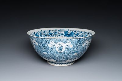 A very fine and rare Dutch Delft blue and white bowl with grotesques in the style of Daniel Marot, dated 1720