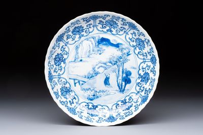 A very fine Chinese blue and white plate with a scholar in a landscape, Kangxi mark and of the period
