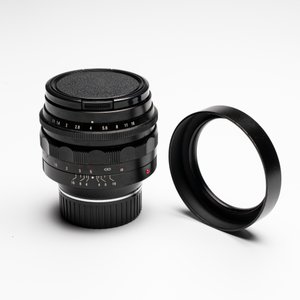 A Voigtländer Nokton 50 mm F1.1 lens and hood — photo 1