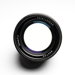 A Voigtländer Nokton 50 mm F1.1 lens and hood — photo 8