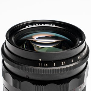 A Voigtländer Nokton 50 mm F1.1 lens and hood — photo 3