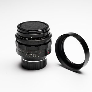 A Voigtländer Nokton 50 mm F1.1 lens and hood — photo 6