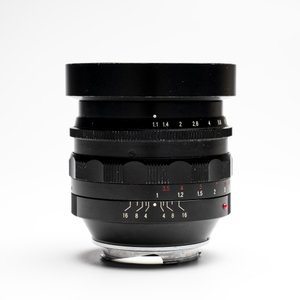 A Voigtländer Nokton 50 mm F1.1 lens and hood — photo 7