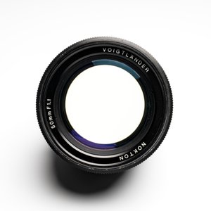 A Voigtländer Nokton 50 mm F1.1 lens and hood — photo 8
