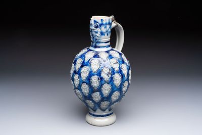 A Westerwald stoneware jug with a lion's head and moulded floral design, Germany, 17th C.