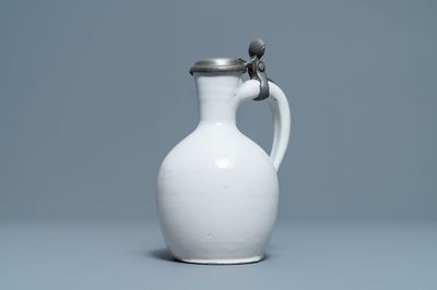 A white Dutch Delft jug with pewter cover, 17th C.