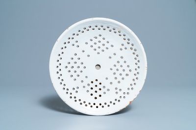 A white Dutch Delftware strainer, 18th C.