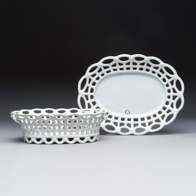 A reticulated white-glazed Brussels faience bread basket on stand, 18th C., 18th C.