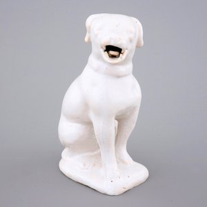 A white monochrome Dutch Delft figure of a dog, 18th C. — photo 1