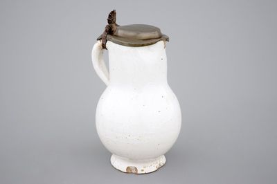 A white monochrome Dutch Delft pewter-mounted jug, 17/18th C.