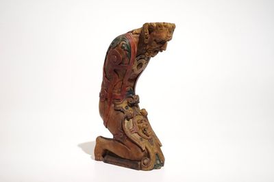 A wooden beam support in the shape of a satyr above a lion crest, The Netherlands, 17th C.