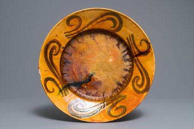 Alfred William Finch (1854 –1930): Een Art Nouveau aardewerk schotel met oker en gele fondkleur