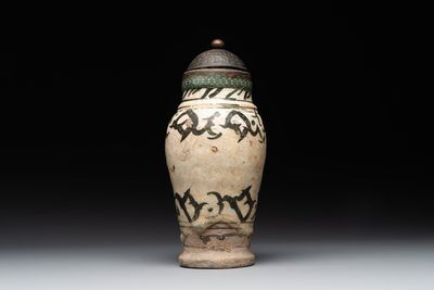 An early Islamic pottery albarello with engraved copper mount and cover, probably Nishapur, Iran, 10/11th C.