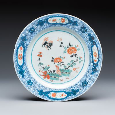 An English-decorated Chinese Kakiemon-style plate, Kangxi