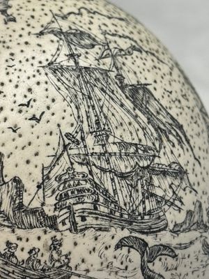 An engraved ostrich egg with a maritime scene on a wooden stand — photo 11