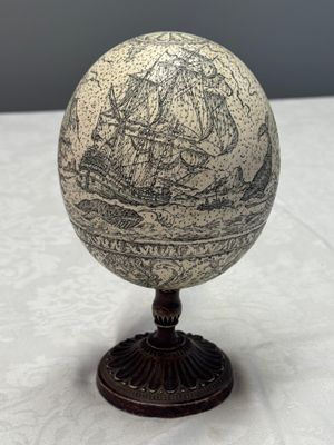 An engraved ostrich egg with a maritime scene on a wooden stand — photo 3