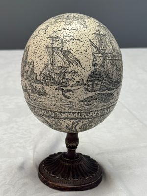 An engraved ostrich egg with a maritime scene on a wooden stand — photo 4