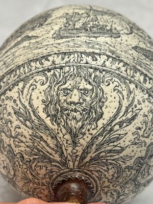 An engraved ostrich egg with a maritime scene on a wooden stand — photo 7