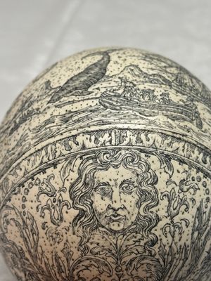 An engraved ostrich egg with a maritime scene on a wooden stand — photo 8