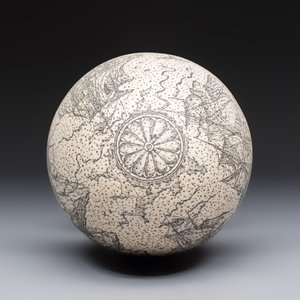 An engraved ostrich egg with a maritime scene on a wooden stand — photo 5