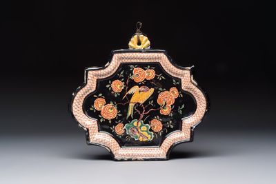 An exceedingly rare polychrome black-ground Dutch Delft plaque with a parrot, 18th C.