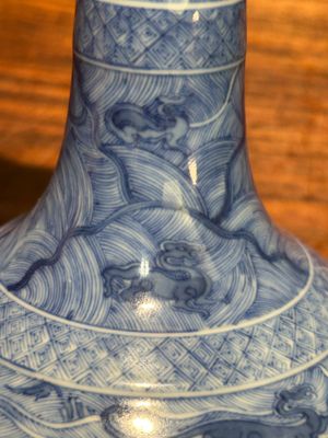 An exceptional Chinese blue and white 'mythic animals' garlic-mouth bottle vase on wooden stand, Kangxi mark and of the period — photo 32