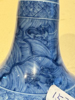 An exceptional Chinese blue and white 'mythic animals' garlic-mouth bottle vase on wooden stand, Kangxi mark and of the period — photo 7