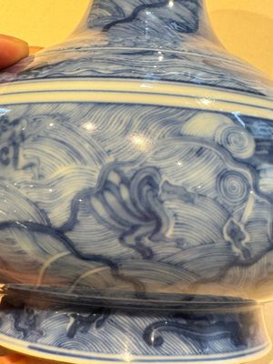 An exceptional Chinese blue and white 'mythic animals' garlic-mouth bottle vase on wooden stand, Kangxi mark and of the period — photo 10
