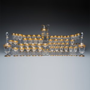 An extensive 53-piece French gilt-decorated 'Thistle Gold' crystal glass service with two decanter labels and a pair of candlesticks — photo 1