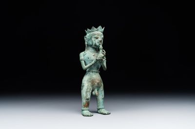 An fine Indonesian bronze sculpture of a naked man offering a sacrificial vase, Majapahit, East Java, 13/14th C.