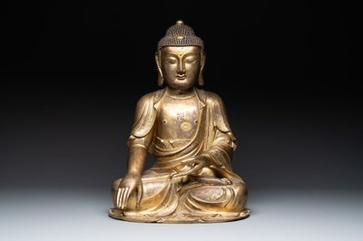 An impressive and large Chinese gilt bronze Buddha, Ming, 16th C.