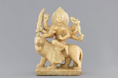 An Indian carved alabaster group of the goddess Durga on her lion "Vahana", 19th C.