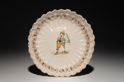 An Italian maiolica crespina with a saint, Deruta, 17th C.