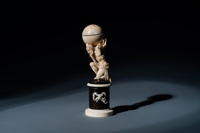 An ivory figure of Atlas carrying the globe, probably Dieppe, 19th C.