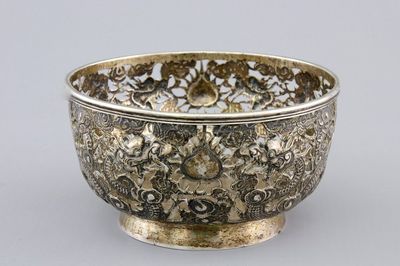 An open-worked Chinese silver dragon bowl, Wang Hing, China, 19th C.