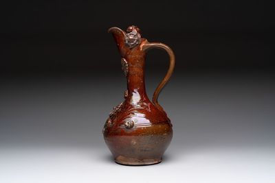 An Ottoman Canakkale pottery ewer with applied floral rosettes, Turkey, 19th C