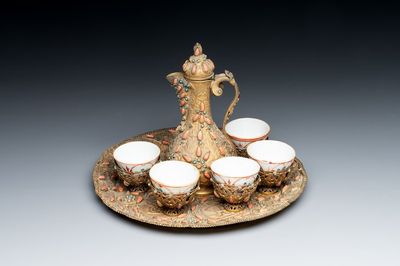 An Ottoman coral-and-turquoise-inlaid gilt-copper tea service with five Chinese wucai cups, 19th C.