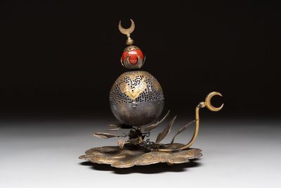 An Ottoman gilt-bronze inscribed incense burner with a red stone, 19th C.