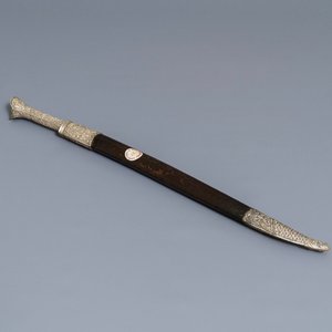 An Ottoman silver-mounted Damascus steel 'yatagan' sword in its leather sheath, Turkey, 19th C. — photo 1