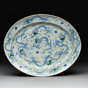 An oval Chinese Canton famille verte 'nine dragons' dish, 19th C. — photo 1