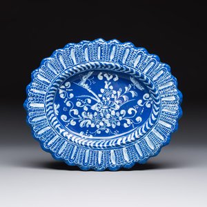 An oval French Persian-blue-ground white-decorated faience dish with butterflies and foliage, Nevers, 17th C. — photo 1