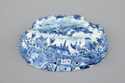 An unusual blue and white Chinese porcelain walnut-shaped hanging ornament or lid, 18th C.