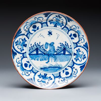 An unusual blue and white Dutch Delft plate depicting a man of African or South Asian origin, 18th C.
