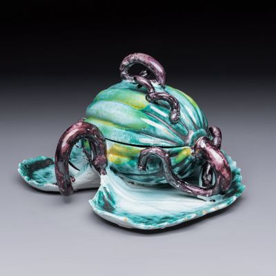 An unusual Brussels faience melon-shaped tureen and cover on leaf-form stand, 18th C., 18th C.
