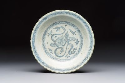 An unusual Chinese blue and white celadon-back 'Buddhist Lion' plate, Ming